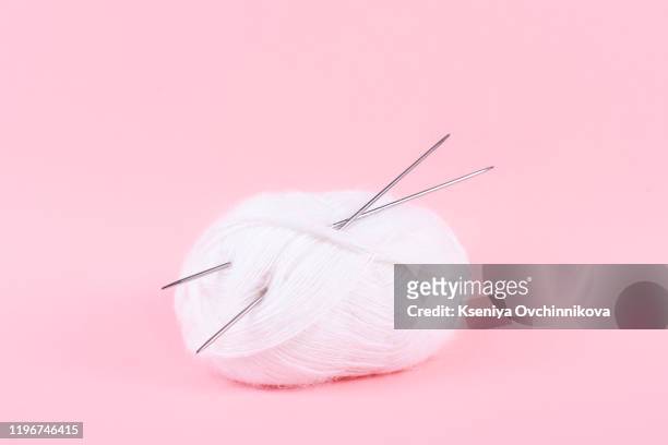woollen thread and knitting needle. needlework accessories isolated on white background. - thread sewing item stock-fotos und bilder