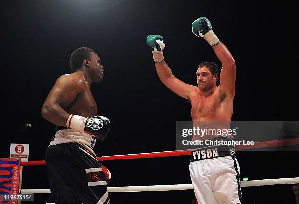 Tyson Fury celebrates his victory after the final round against Dereck Chisora during the British & Commonwealth Heavyweight Title Fight between...