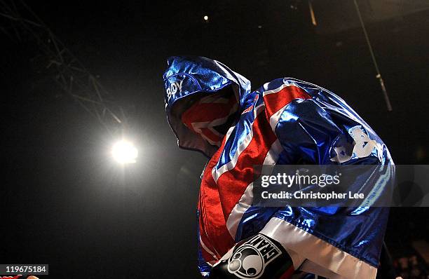 Dereck Chisora enters the ring wearing a Union Flag gown and a Union Flag scarf during the British & Commonwealth Heavyweight Title Fight between...