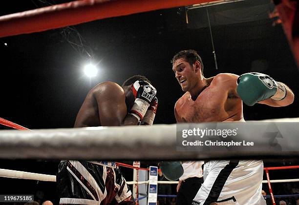 Tyson Fury gets Dereck Chisora in the corner during the British & Commonwealth Heavyweight Title Fight between Dereck Chisora and Tyson Fury at...