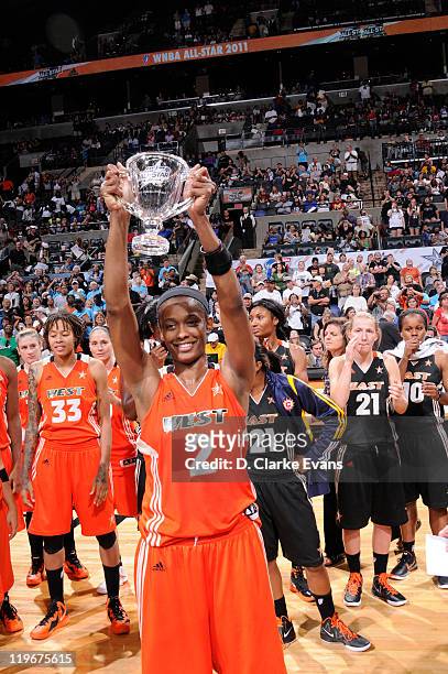 Swin Cash of the Western Conference All-Stars holds up the MVP Trophy against the Eastern Conference All-Stars during the 2011 WNBA All-Star Game at...