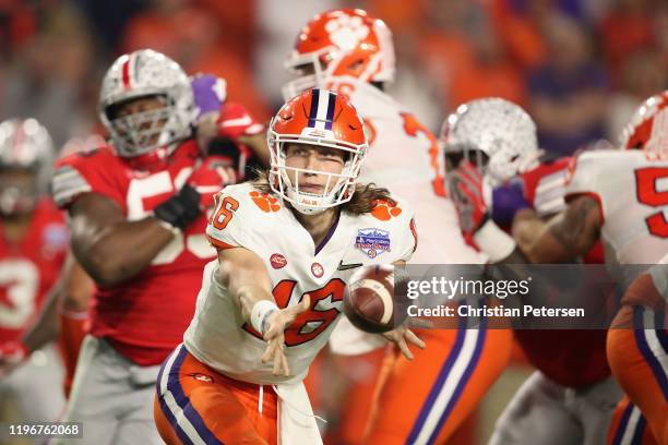 Quarterback Trevor Lawrence of the Clemson Tigers pitches the football during the PlayStation Fiesta Bowl against the Ohio State Buckeyes at State...