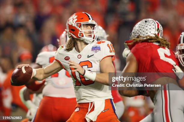 Quarterback Trevor Lawrence of the Clemson Tigers drops back to pass during the PlayStation Fiesta Bowl against the Ohio State Buckeyes at State Farm...