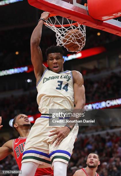 Giannis Antetokounmpo of the Milwaukee Bucks slams a reverse dunk against the Chicago Bulls at the United Center on December 30, 2019 in Chicago,...