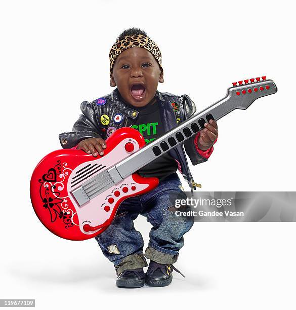 baby boy dressed up as rock star - funny rock star stock pictures, royalty-free photos & images