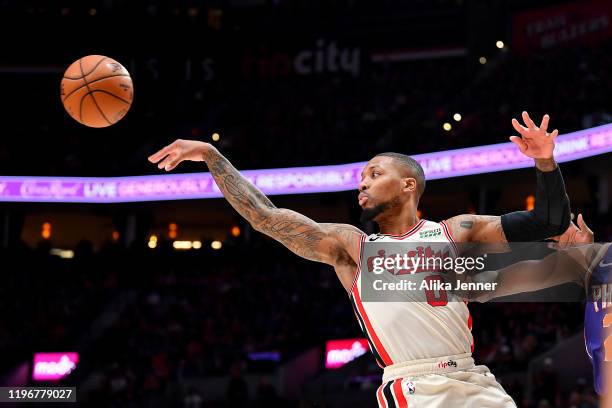 Damian Lillard of the Portland Trail Blazers passes the ball while driving to the basket during the second half of the game against the Phoenix Suns...