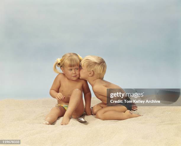 boy kissing girl on beach - kids in undies stock pictures, royalty-free photos & images