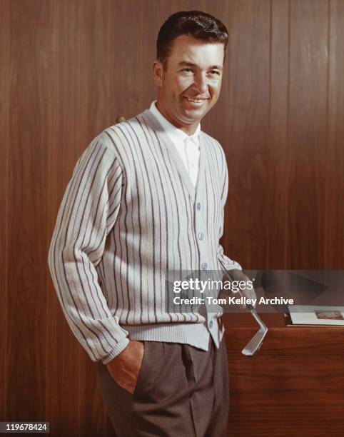 man holding golf club, smiling - 1960 stock pictures, royalty-free photos & images