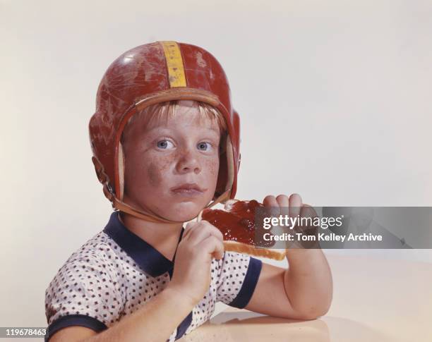 boy in helmet holding jam and bread, close-up - 1961 stock pictures, royalty-free photos & images