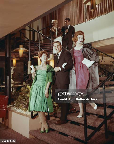 couple walking down staircase, smiling - 1962 bildbanksfoton och bilder