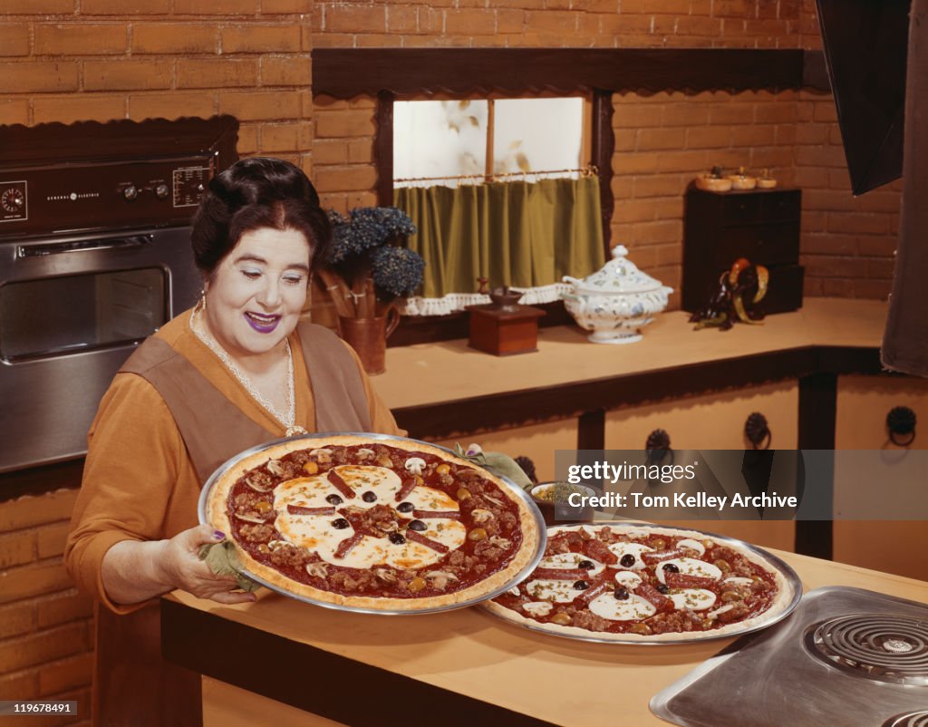 mature homemade Mature Woman Holding Fresh Homemade Pizza Smiling High-Res Stock Photo - Getty Images
