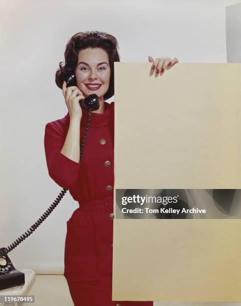 young woman holding phone, portrait - 1962 bildbanksfoton och bilder