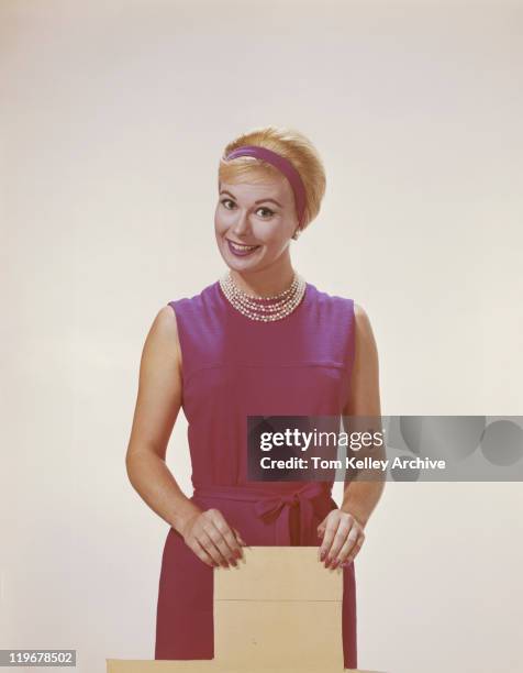 young woman holding board, portrait - 1962 stock pictures, royalty-free photos & images