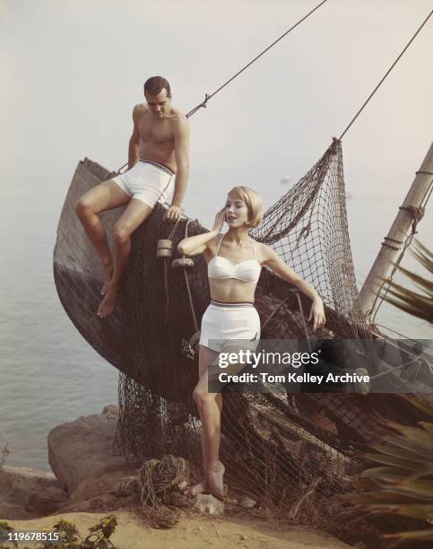 couple leaning on boat at sea side - 1962 bildbanksfoton och bilder