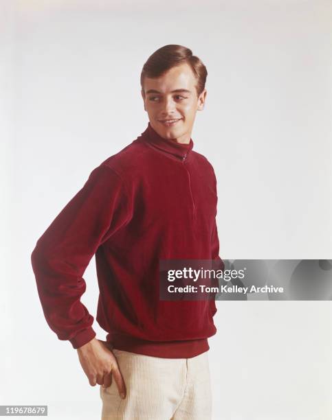 young man standing against white background, smiling - archival 1960s stock pictures, royalty-free photos & images