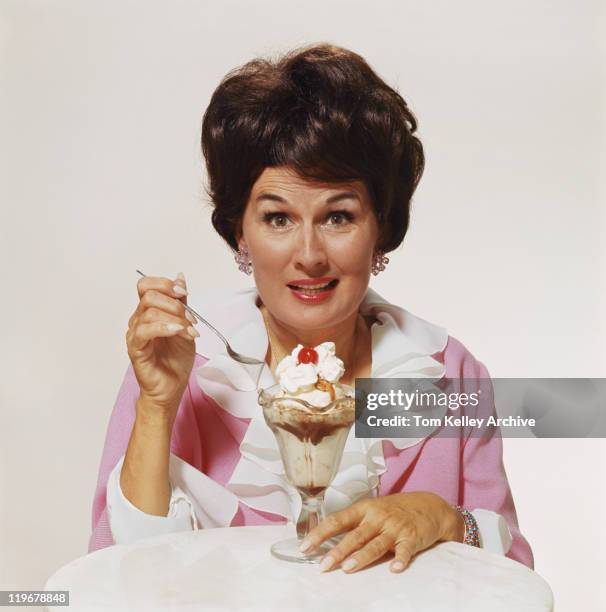 mature woman in front of sundae against white background, close-up - 1968 stock pictures, royalty-free photos & images