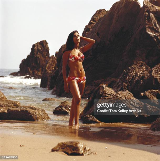 young woman in bikini standing on beach - vintage swimwear stock pictures, royalty-free photos & images