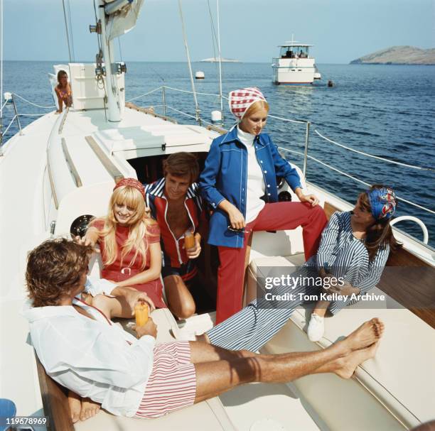 group of friends in sailing boat - 1970 stock pictures, royalty-free photos & images