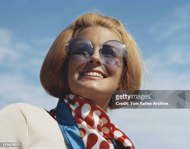 young woman wearing sunglasses, smiling, close-up - vintage fashion stock pictures, royalty-free photos & images