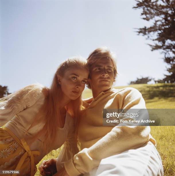 couple leaning on grass - historical romance stock pictures, royalty-free photos & images