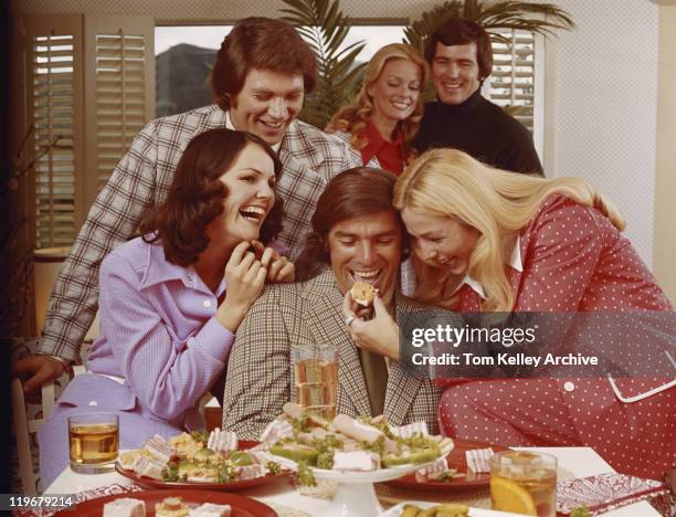 woman feeding sweet to man, smiling - 1973 stock pictures, royalty-free photos & images