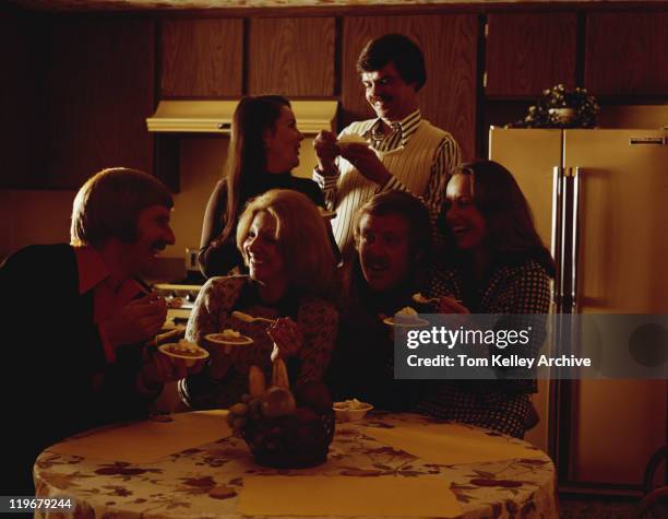 friends talking at dining table and eating dessert - 1973 30-39 stock pictures, royalty-free photos & images