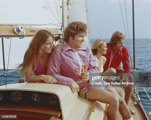 couples sitting on sailing boat, smiling - vintage boat photo stock pictures, royalty-free photos & images