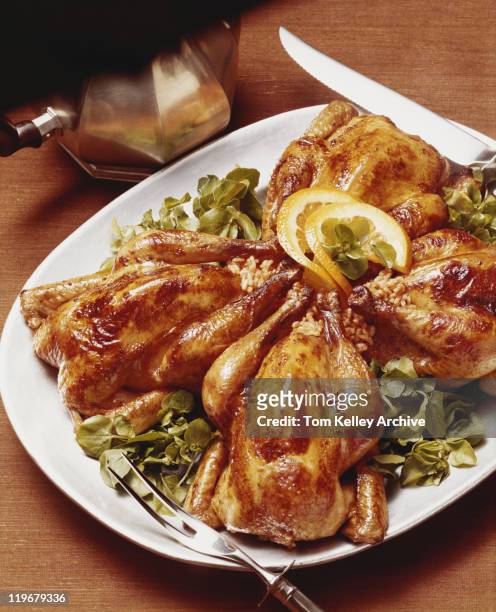 roasted chickens on plate, close-up - 1977 stock pictures, royalty-free photos & images