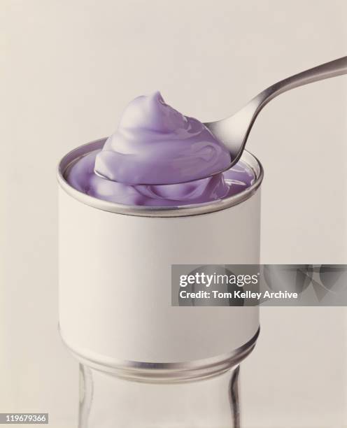spoon of cream with tin can, close-up - 1977 stock pictures, royalty-free photos & images