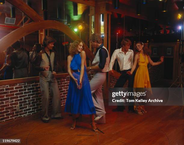 couples dancing together at nightclub, smiling - 1970s stock pictures, royalty-free photos & images