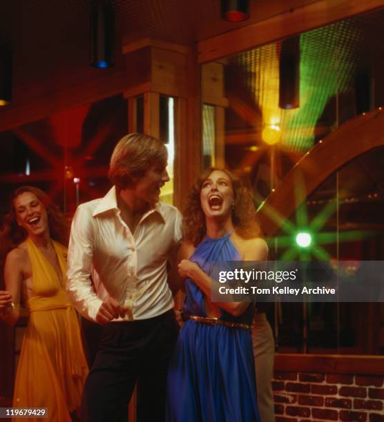 couples dancing together at nightclub, smiling - archive danse stock pictures, royalty-free photos & images