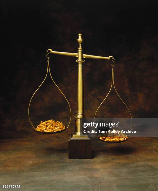 french fries on scales - 1982 stock pictures, royalty-free photos & images