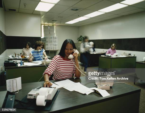 women working and attending calls in office - archival 1980s stock pictures, royalty-free photos & images