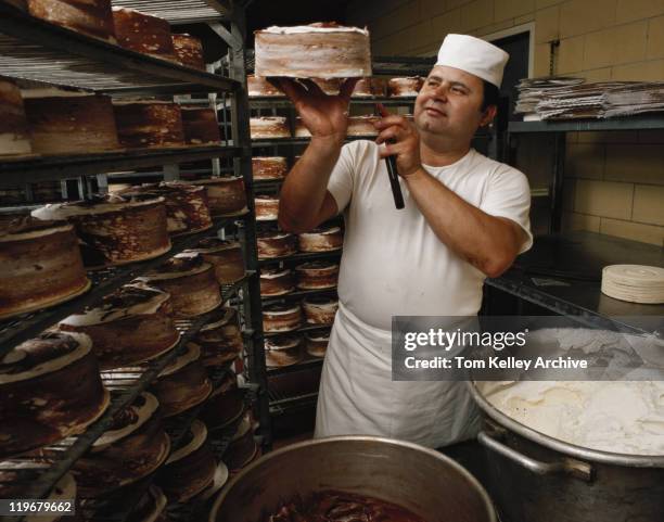 baker making cake in bakery - 1983 stock pictures, royalty-free photos & images