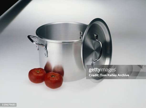 stew pot with open lid and tomatoes on white background, close-up - 1983 stock pictures, royalty-free photos & images