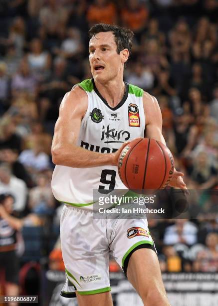 Ben Madgen of the Phoenix looks to pass the ball during the round 13 NBL match between the Cairns Taipans and the South East Melbourne Phoenix on...