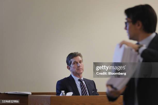 Alex Gorsky, chief executive officer of Johnson & Johnson, listens while being questioned on the stand at Middlesex County Superior Court in New...