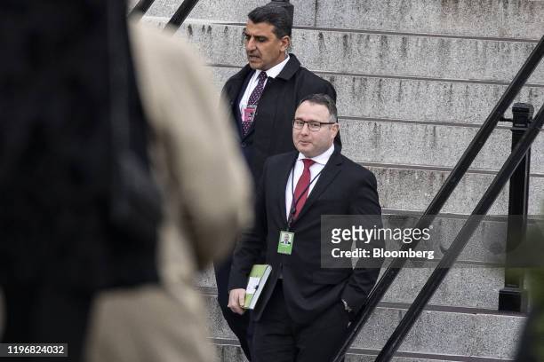 Alexander Vindman, director for European affairs on the National Security Council, right, exits the Eisenhower Executive office building at the White...