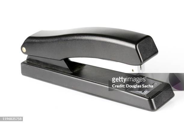 desk stapler on a white background - staples office stockfoto's en -beelden