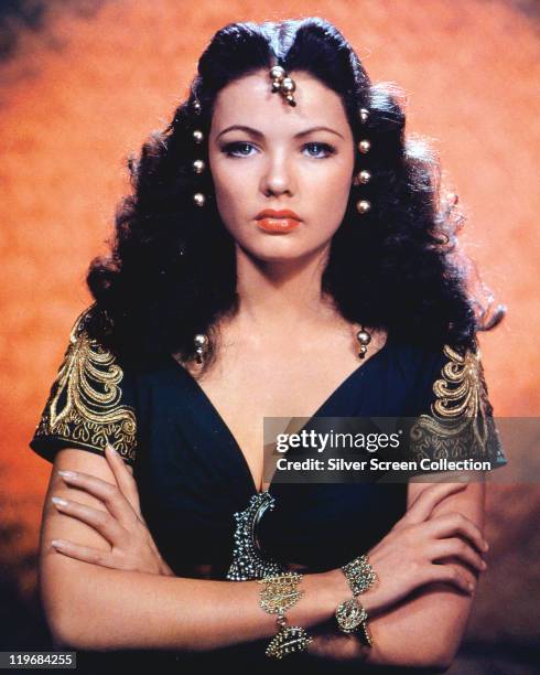 Gene Tierney , US actress, wearing gold beads in her long curly hair in a publicity portrait issued for tthe film, 'Sundown', USA, 1941. The war...