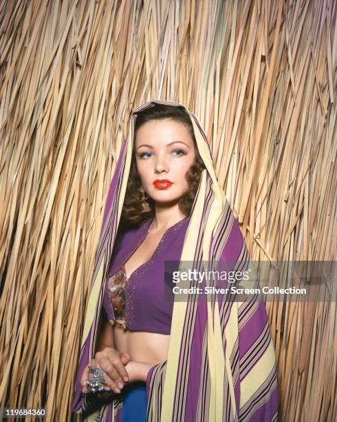 Gene Tierney , US actress, wearing a stiped shawl over her head in a publicity portrait issued for the film, 'The Shanghai Gesture', 1941. The drama,...