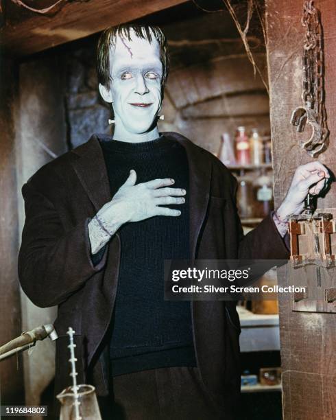 Fred Gwynne , US actor, in costume in a publicity portrait issued for the US television series, 'The Munsters', USA, circa 1965. The sitcom starred...