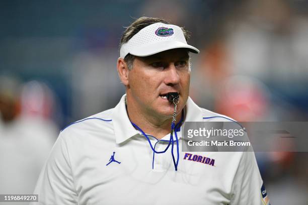 Head Coach Dan Mullen of the Florida Gators on the field during warm ups prior to the Capital One Orange Bowl against the Virginia Cavaliers at Hard...
