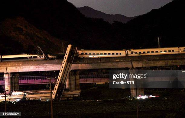 General view shows the wreckage of a high-speed train which derailed between the cities of Hangzhou and Wenzhou, in eastern China's Zhejiang province...