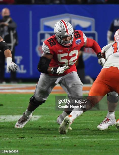 Wyatt Davis of the Ohio State Buckeyes blocks against the Clemson Tigers during the Playstation Fiesta Bowl at State Farm Stadium on December 28,...