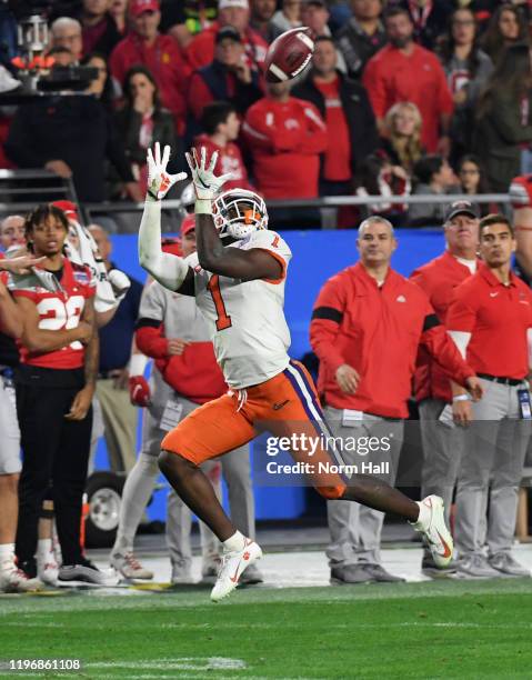 Derion Kendrick of the Clemson Tigers attempts to catch a pass against the Ohio State Buckeyes during the Playstation Fiesta Bowl at State Farm...