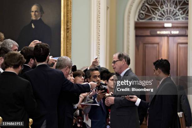 Senator Mike Braun, a Republican from Indiana, center, speaks to members of the media at the U.S. Capitol in Washington, D.C., U.S., on Monday, Jan....