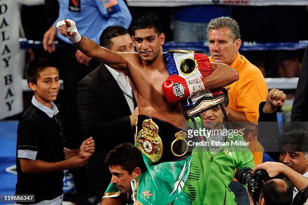 Amir Khan celebrates his fifth round knockout of Zab Judah in their super lightweight world championship unification bout at Mandalay Bay Events...