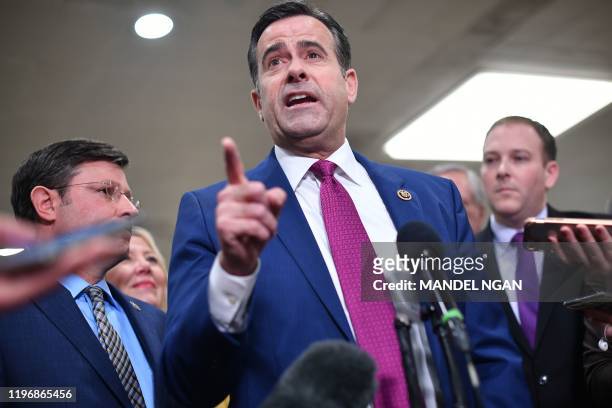 Rep. John Ratcliffe, R-TX, speaks to the press at the US Capitol in Washington, DC on January 27, 2020. - White House lawyers were to resume their...