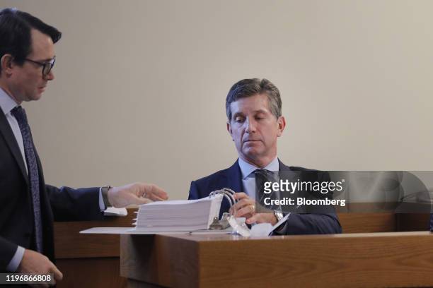 Alex Gorsky, chief executive officer of Johnson & Johnson, listens while being questioned on the stand at Middlesex County Superior Court in New...